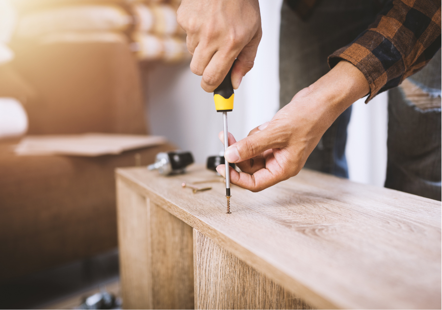 Bufab-man-screws-in-a-board